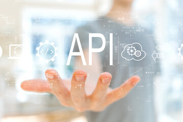 API - application programming interface concept with young man holding his hand