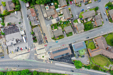 Aerial photo of the village of Pudsey in Leeds West Yorkshire showing a typical British housing estate taken on a hot sunny day in the summer time