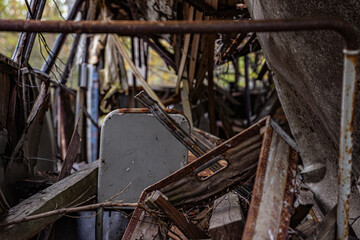 Abandoned metallic stuff on the car cemetery of Kyrkö Mosse in Sweden