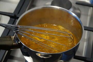 cooking in the kitchen making the sauce for the steak