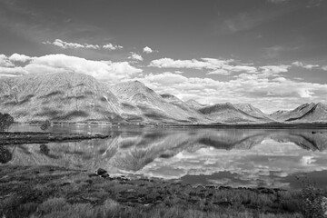Reflections from mountains in a fjord in Norway