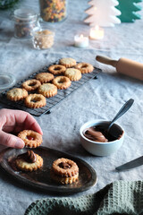Sandwich cookies filled with hazelnut spread, nougat cream. Christmas Linzer cookies filled on...