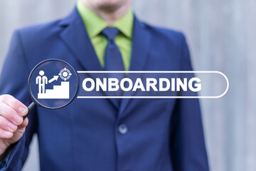 Concept of Business Onboarding Process. Businessman holding magnifying glass with virtual icon and searching bar with onboarding word.