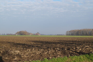 Fototapeta na wymiar plowed field in wintertime