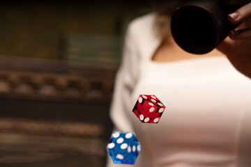 wooden backgammon and girl's hands with bones for the game