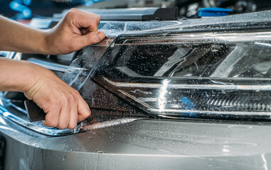 Paint Protection Film for cars or anti-gravel protection coating wrapping on headlight of new...