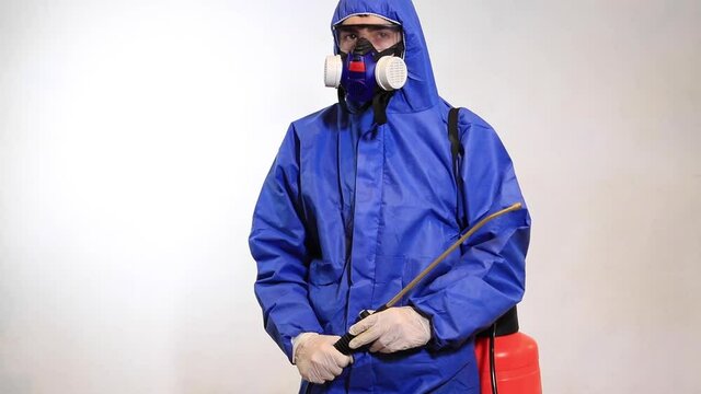 Pest Control Worker In Protective Workwear With Pesticides Sprayer Over White Background