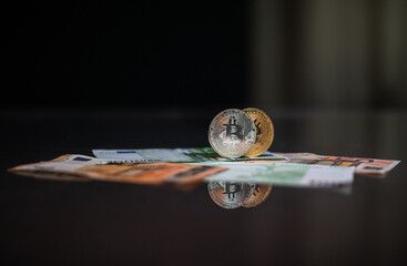 Cryptocurrency bitcoin. Money and bitcoin. Bitcoin is a close plan. Euro banknotes