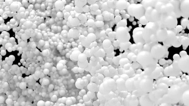 Bubble Burst - white colored foaming balls balloons explosion. White color foam spheres in slow motion macro isolated on black. Alpha channel close shot 60 fps 4k