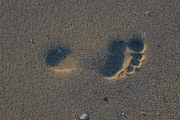 Footprint in sand on a beach in Norway