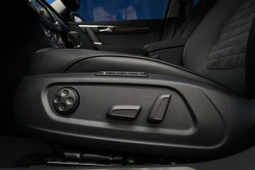 Car interior detail. Buttons for adjusting seat position.
