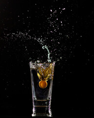 Physalis dropping into water and making a splash