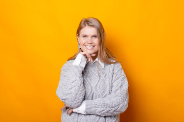 Portrait of joyful young woman in casual looking confident at the camera.