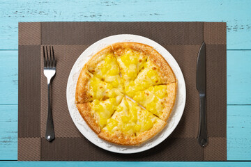 top view fresh pizza with fruit toppings on a table