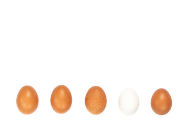 Five white and brown chicken eggs in a row isolated against a white background.