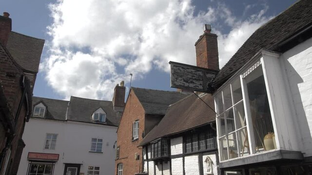 Timber clad buildings on narrow street on sunny day in summer, Lichfield, Staffordshire, England, United Kingdom, Europe