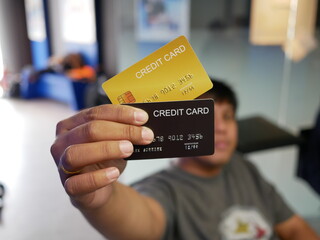 man is holding credit card and showing,online shopping concept.