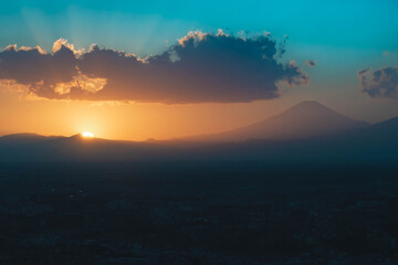 Fototapeta na wymiar Sunset behind Mt Fuji in Yokohama Japan with Tokyo city below.