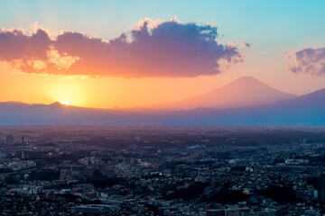 Fototapeta na wymiar Sunset behind Mt Fuji in Yokohama Japan with Tokyo city below.