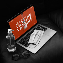 Laptop screen showing COVID-19 vaccine vial ads