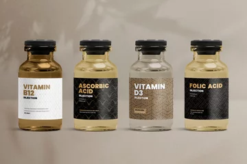 Fotobehang Vitamin injection vial glass bottles with luxurious patterned labels © Rawpixel.com