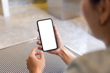 cell phone blank white screen mockup.woman hand holding texting using mobile on desk at office.background empty space for advertise.work people contact marketing business,technology