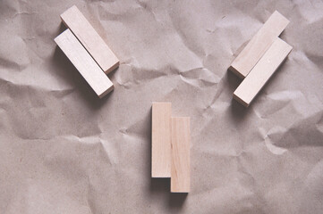 background of crumpled craft paper with wooden rectangles arranged in a certain order