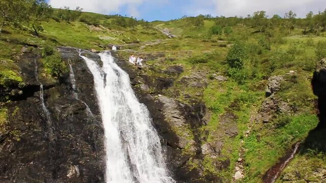 Amazing norwegian landscape with beautiful river waterfall in Vang Norway.