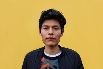 Stock photo of portrait of young man with a sweater and black jacket