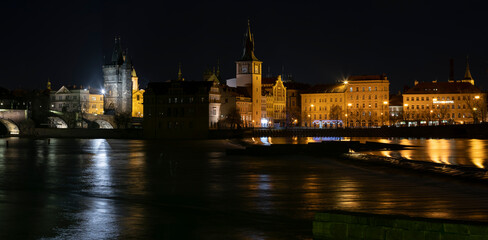 Fototapeta na wymiar .panoramic view of Charles Bridge and illuminated street lights and the surrounding old architecture in the center of Prague in the Czech Republic at night