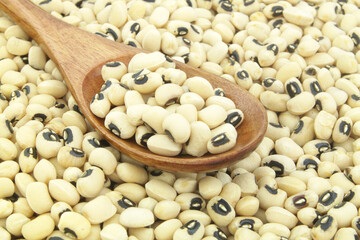 Black eyed beans with wooden spoon