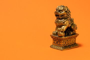 Lion sculpture of Chinese culture. Very popular Chinese decorative and religious ornament. Orange...