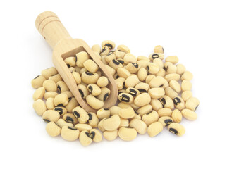 Black eyed beans with wooden scoop isolated on white background