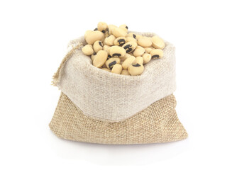 Black eyed beans in burlap sack isolated on white background