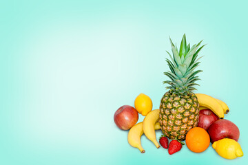 A pile of fresh fruits on a blue background.