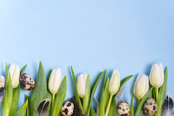 Easter background with eggs and white tulips flat lay