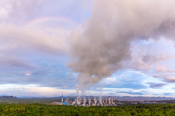 Smoke of cooling over coal power plant Mae Moh Lampang at morning with rainbow, Bird eye view.