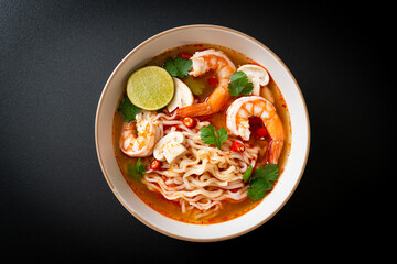 instant noodles ramen in spicy soup with shrimps (Tom Yum Kung)