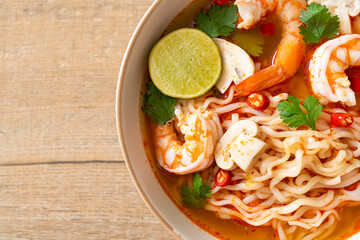 instant noodles ramen in spicy soup with shrimps (Tom Yum Kung)