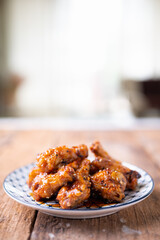 Sour-sweet baked chicken wings sesame and  teriyaki sauce.