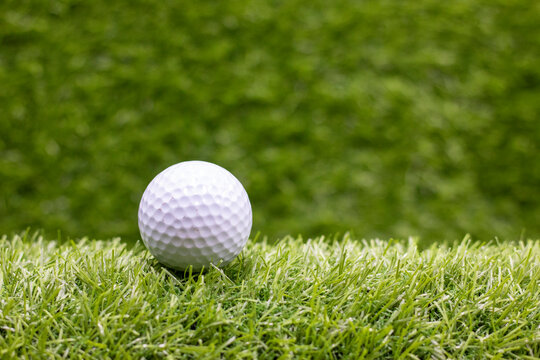 Golf ball is on green grass