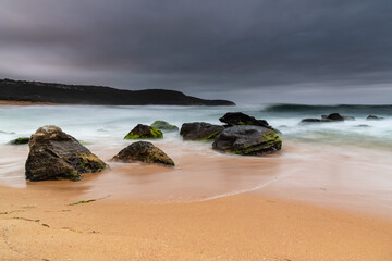 Low cloud filled sky and sunrise seascape