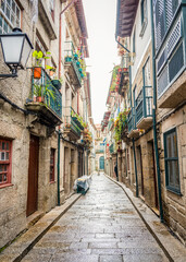 Fototapeta na wymiar Old narrow street of the city of Guimaraes, Portugal