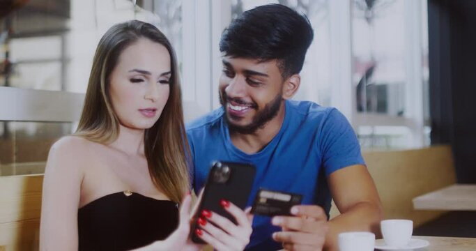Young couple online banking using smartphone shopping online with credit card at balcony of your home lifestyle. Cinematic Premium Video. 4K.