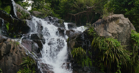 Fototapeta na wymiar Cascade waterfall river in tropical forest