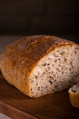 Cut freshly baked bread on a wooden board