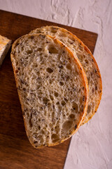 Cut freshly baked bread on a wooden board