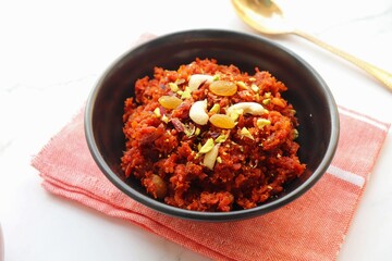 Gajar Halwa. Indian carrot pudding. It's a sweet dessert made from carrots, sugar, and cream. Garnished with cashew, almond, Raisin, and pistachio.