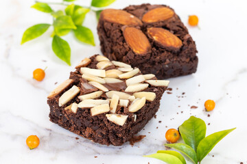 dessert snack brownies with leaf arrangement flat lay style on background white