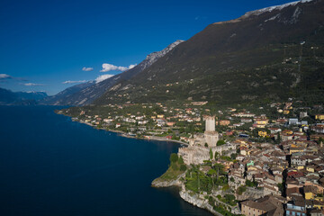 Obraz premium Malcesine town, Lake Garda, Italy. Italian resort on Lake Garda, Monte Baldo. Panoramic aerial view of the Scaliger Castle in Malcesine in Malcesine.